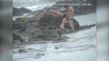 Couple is caught fucking on the beach during storm